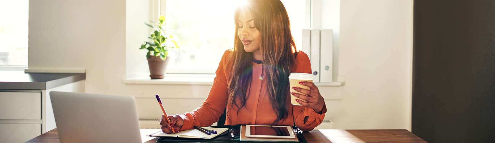 Woman sitting at office desk.